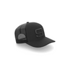 A side view of a black cap with a black embroidered Steadyrack logo on the front and side, featuring a mesh back.