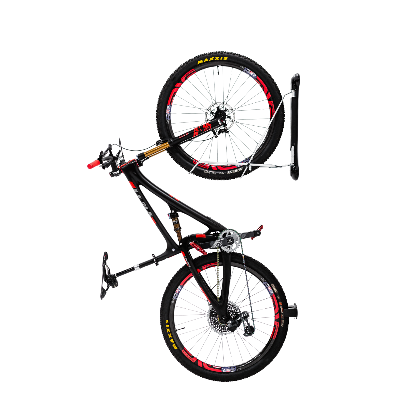 A Steadyrack Classic MTB Rack mounted on a wall, holding a mountain bike with red accents.